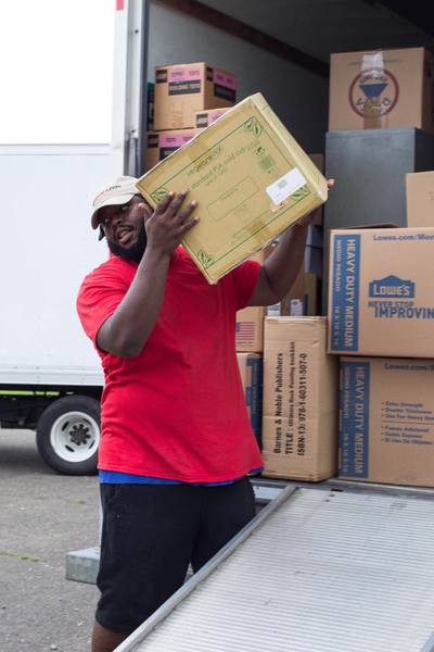 Antwan D managing a moving project and unloading a moving truck